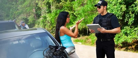 Woman talking to police after car crash